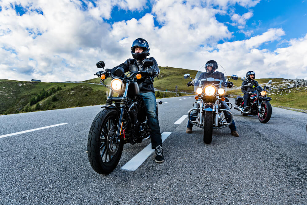 Group of motorcycle riders in the road