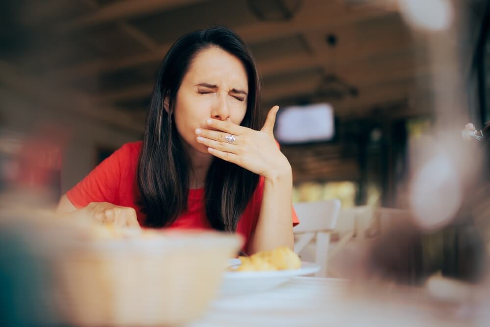 Woman feeling sick from food poisoning.