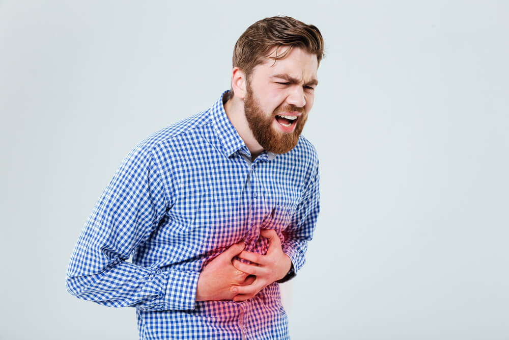 Man suffering abdominal pain from accident.