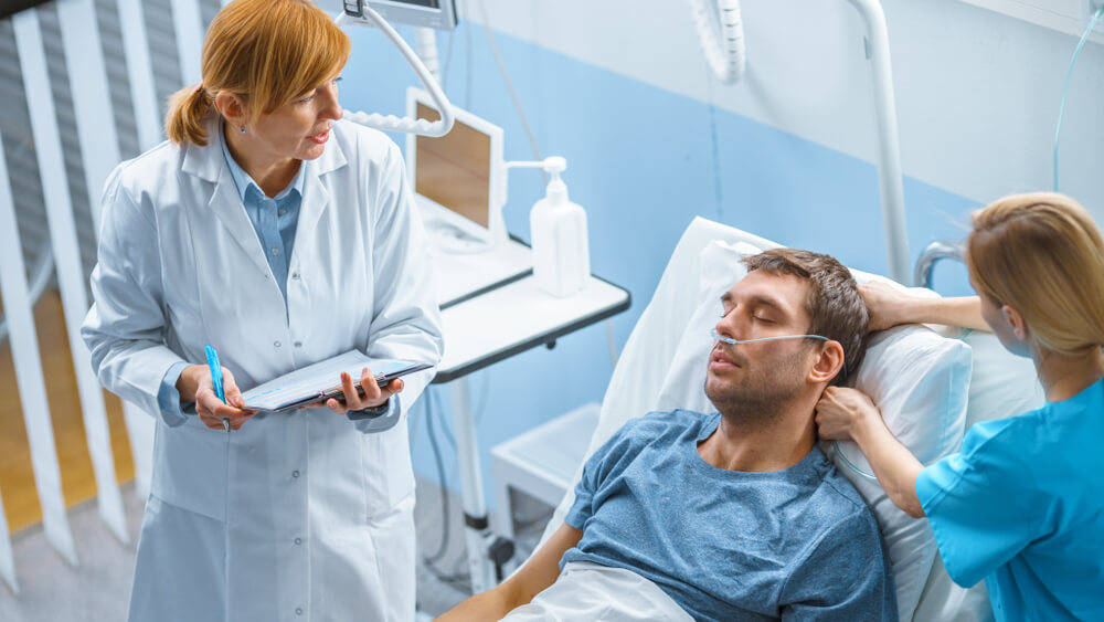 Doctor checking on patients condition.